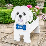 Shih Tzu dog planter filled with fresh flowers is placed in the garden