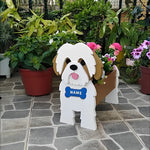 Shih Tzu dog planter filled with fresh flowers is placed in the garden