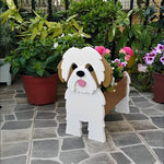 Shih Tzu dog planter filled with fresh flowers is placed in the garden