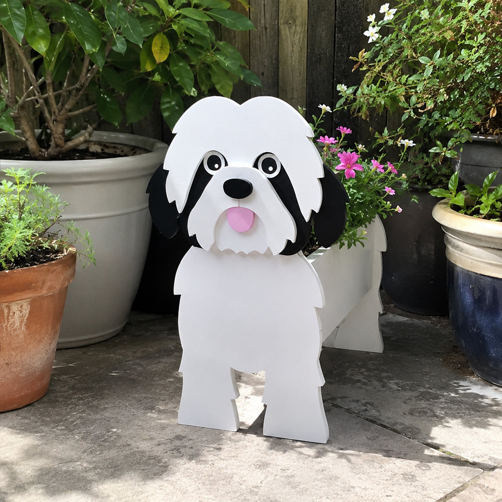 Shih Tzu dog planter filled with fresh flowers is placed in the garden