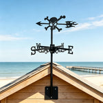 Skull and crossbones metal weather vane with directional arrows and mounting rod, outdoor roof and garden decoration