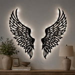 Black metal Soaring Angel Wings wall art with Soft White LED Lighting displayed on the wall