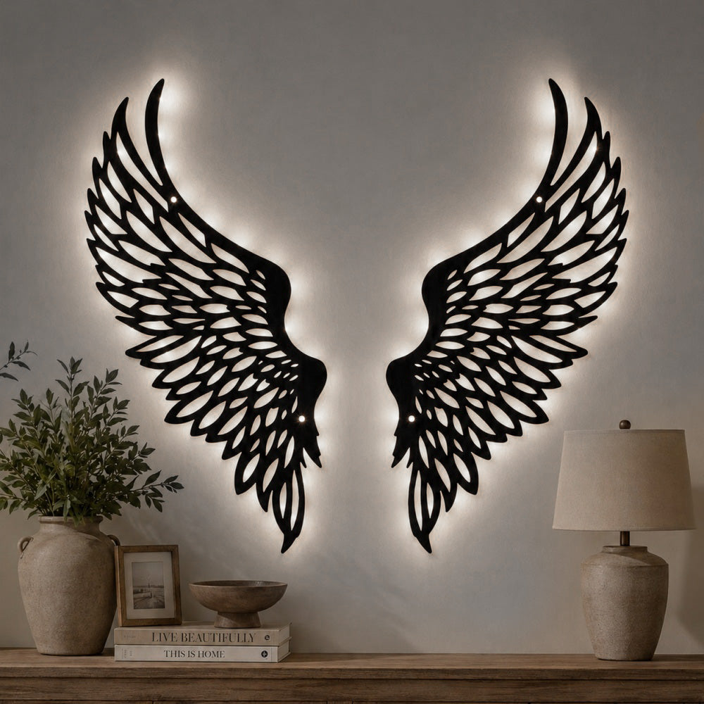 Black metal Soaring Angel Wings wall art with Soft White LED Lighting displayed on the wall