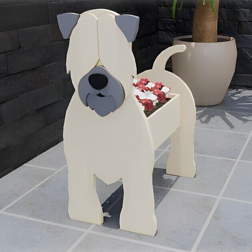 Soft Coated Wheaten Terrier dog planter filled with fresh flowers is placed in the garden