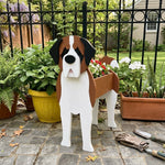 St. Bernard dog planter filled with fresh flowers is placed in the garden