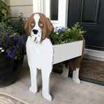 St. Bernard dog planter filled with fresh flowers is placed in the garden