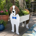 St. Bernard dog planter filled with fresh flowers is placed in the garden