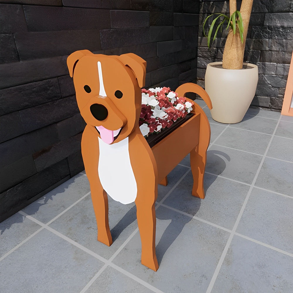 Staffordshire Bull Terrier dog planter filled with fresh flowers is placed in the garden