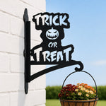 Trick or treat pumpkin metal hanging basket bracket mounted on outdoor wall for plant decoration