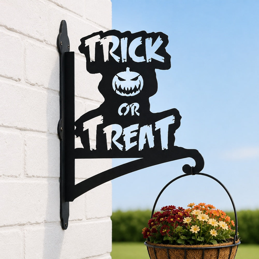 Trick or treat pumpkin metal hanging basket bracket mounted on outdoor wall for plant decoration