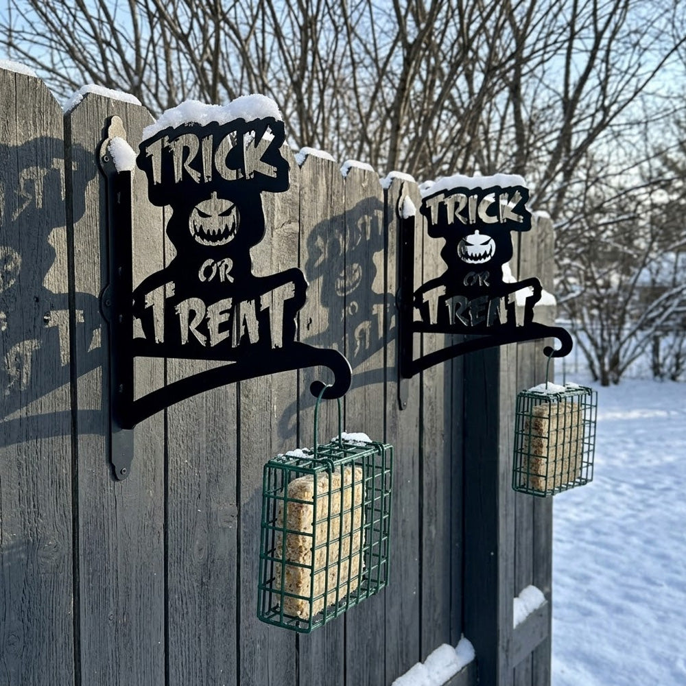 Trick or treat pumpkin metal hanging basket bracket mounted on outdoor wall for plant decoration