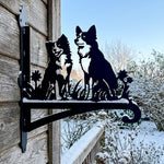 Two border collies metal hanging basket bracket mounted on outdoor wall for plant decoration