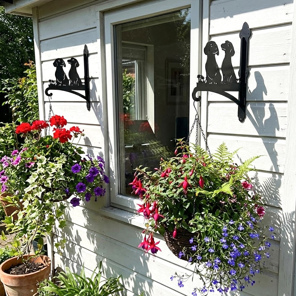 Two dachshunds metal hanging basket bracket mounted on outdoor wall for plant decoration
