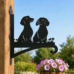 Two dachshunds metal hanging basket bracket mounted on outdoor wall for plant decoration