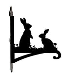 Two rabbits metal hanging basket bracket mounted on outdoor wall for plant decoration