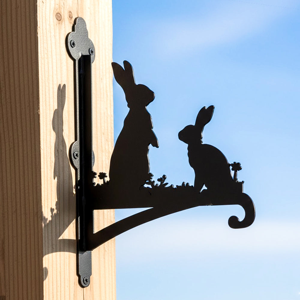 Two rabbits metal hanging basket bracket mounted on outdoor wall for plant decoration