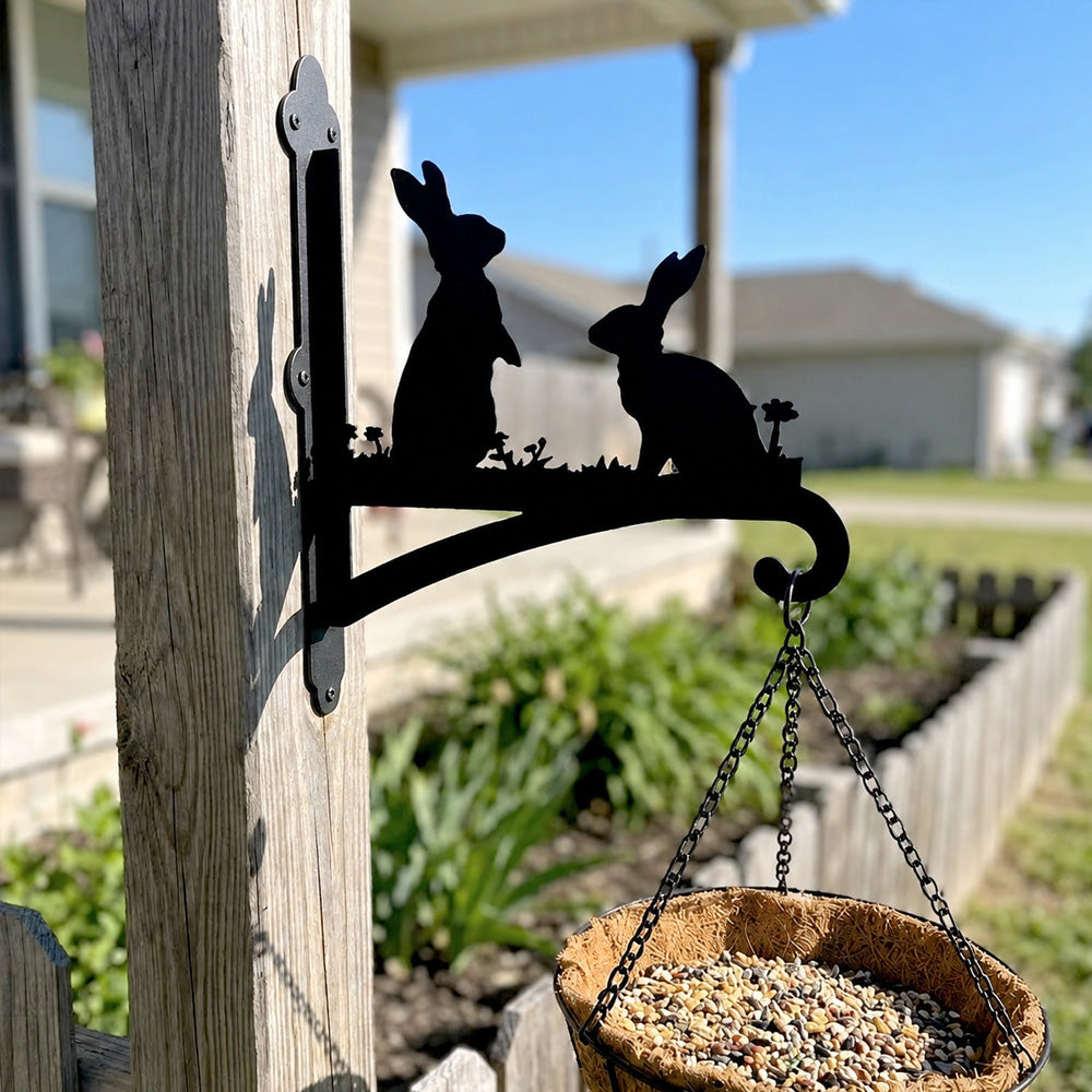 Two rabbits metal hanging basket bracket mounted on outdoor wall for plant decoration