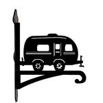 Vintage camper metal hanging basket bracket mounted on outdoor wall for plant decoration