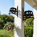 Vintage camper metal hanging basket bracket mounted on outdoor wall for plant decoration