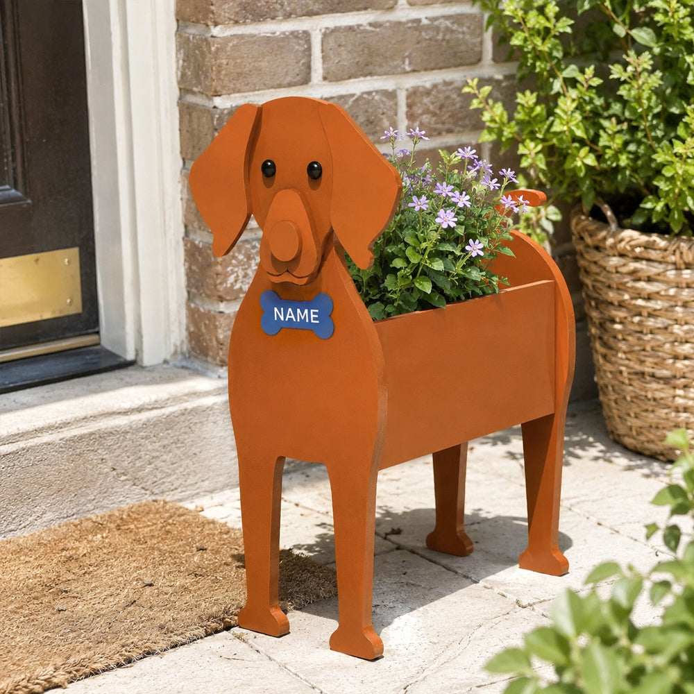 Vizsla dog planter filled with fresh flowers is placed in the garden
