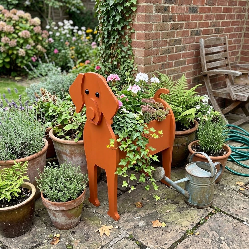 Vizsla dog planter filled with fresh flowers is placed in the garden