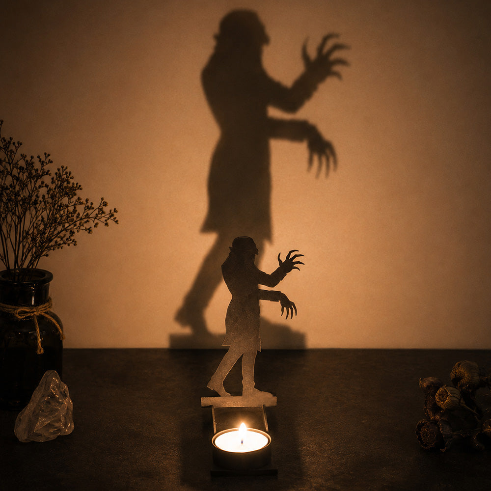 Wandering zombie halloween metal candle holder casting a spooky shadow on the wall