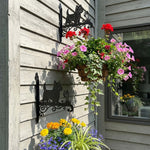 West highland white terrier metal hanging basket bracket mounted on outdoor wall for plant decoration