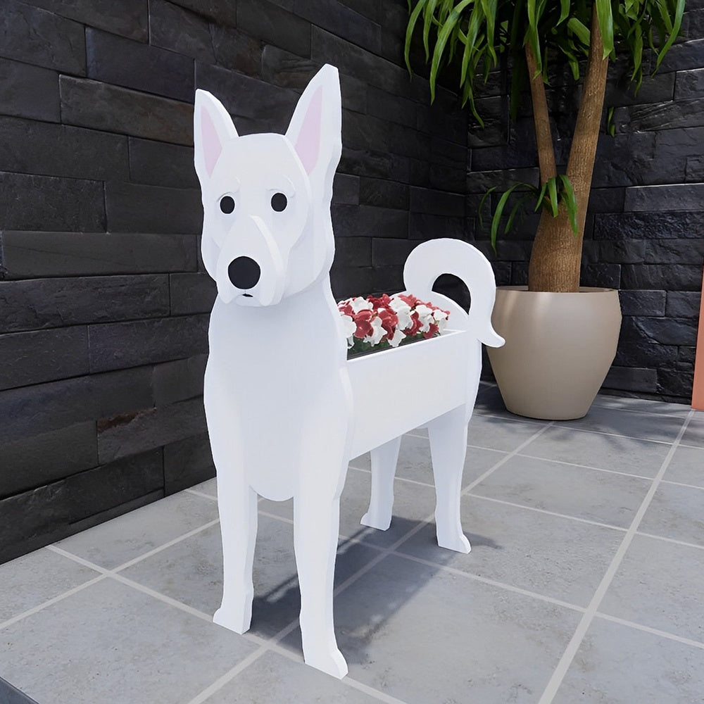 White Swiss Shepherd Dog planter filled with fresh flowers is placed in the garden