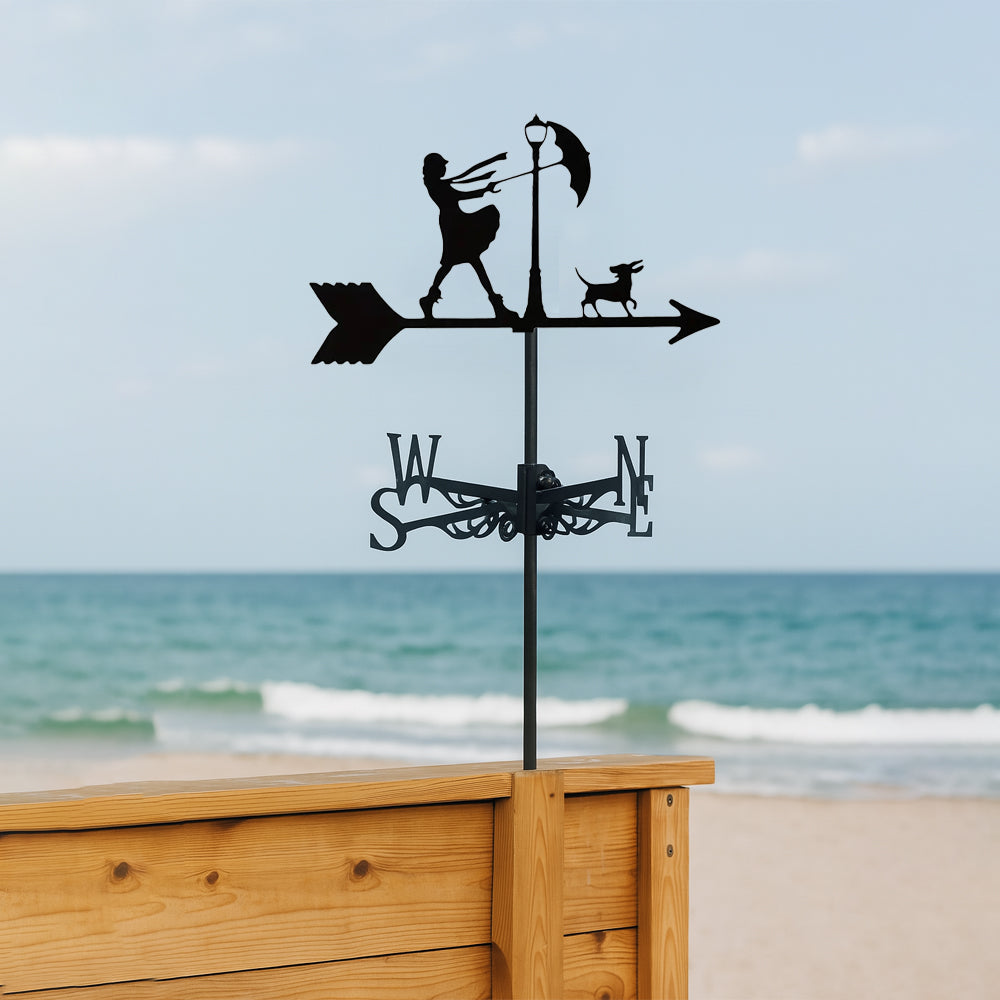 Windy day girl with umbrella metal weather vane with directional arrows and mounting rod, outdoor roof and garden decoration