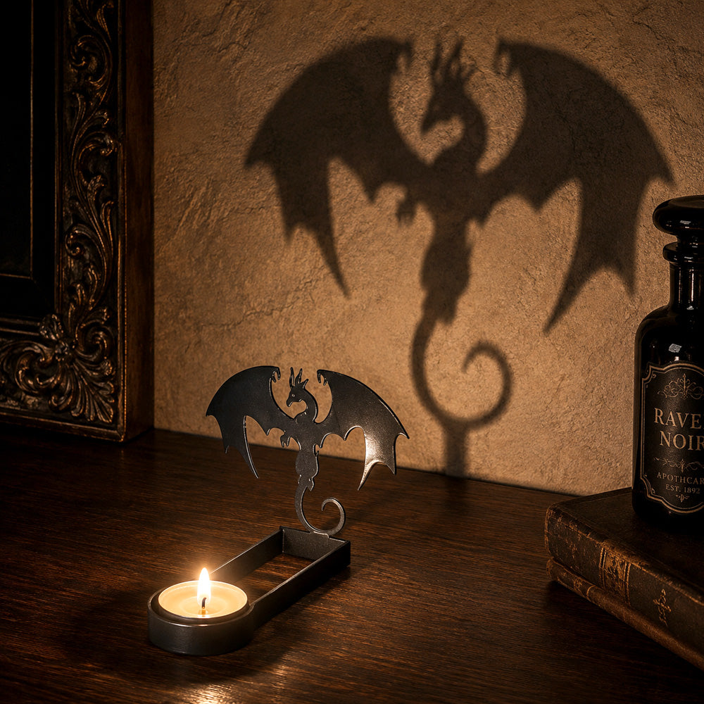 Winged dragon halloween metal candle holder casting a spooky shadow on the wall