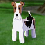 Wire Fox Terrier dog planter filled with fresh flowers is placed in the garden