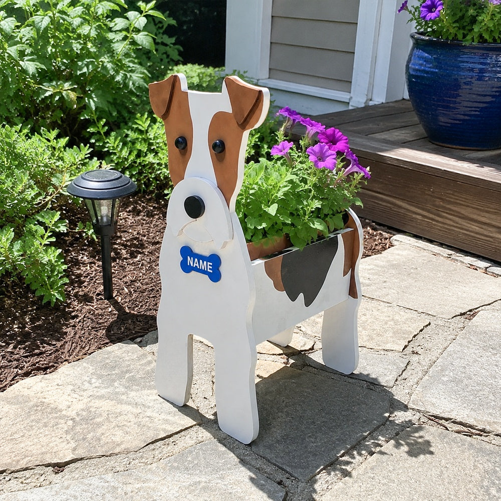 Wire Fox Terrier dog planter filled with fresh flowers is placed in the garden