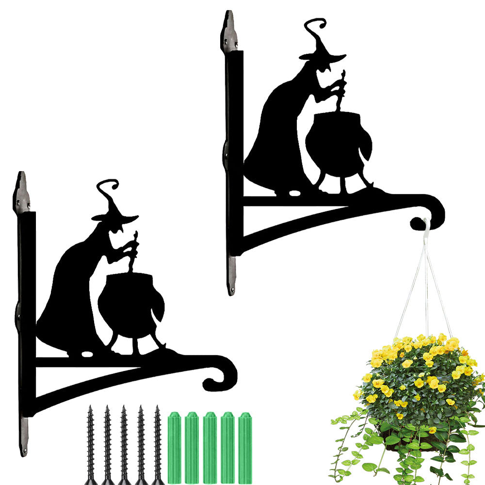 Witch and cauldron metal hanging basket bracket mounted on outdoor wall for plant decoration
