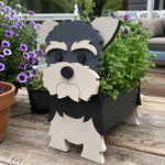 Yorkshire Terrier dog planter filled with fresh flowers is placed in the garden