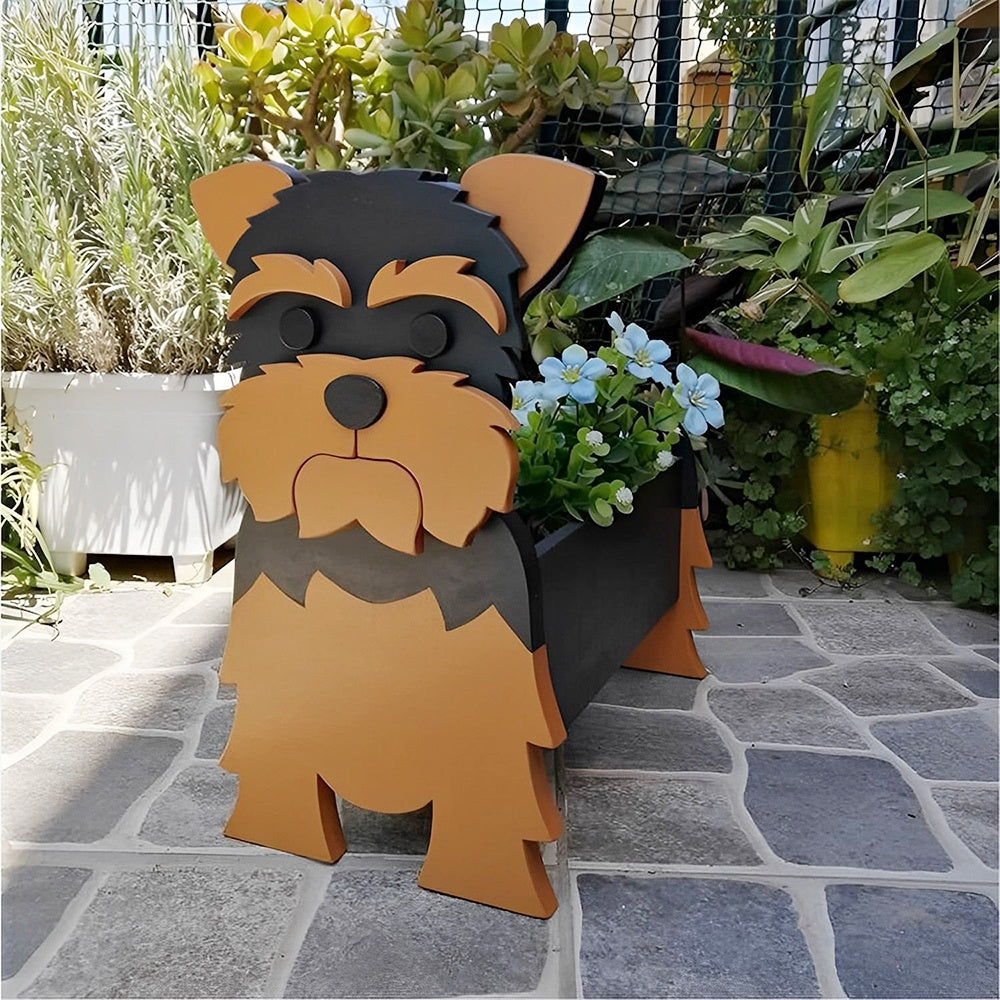 Yorkshire Terrier dog planter filled with fresh flowers is placed in the garden