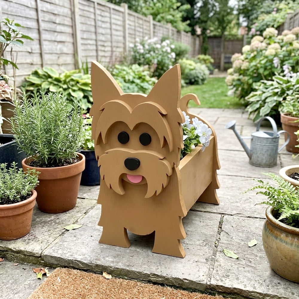 Yorkshire Terrier dog planter filled with fresh flowers is placed in the garden