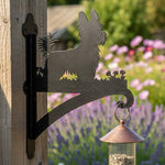 Yorkshire terrier metal hanging basket bracket mounted on outdoor wall for plant decoration