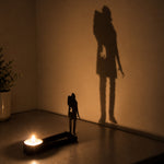 Zombie halloween metal candle holder casting a spooky shadow on the wall